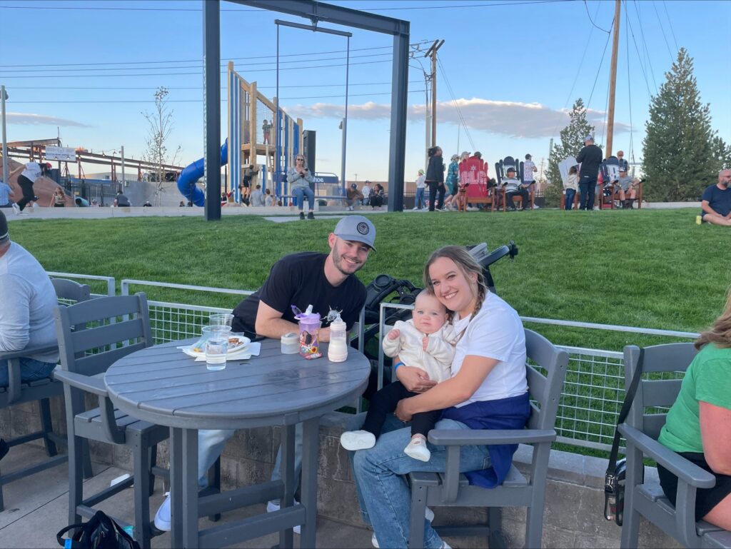 Inline image showing anLP Insurance team member with their young family at a Reno Aces game. 